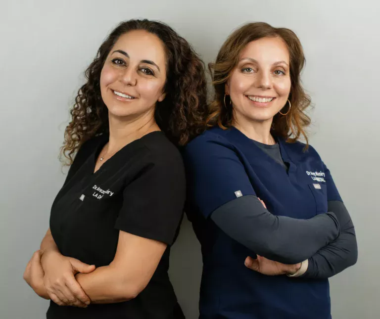 Dr. Nasiry and Dr. Azy smiling together at LA Dental, ready to help you with your smile goals in Los Angeles